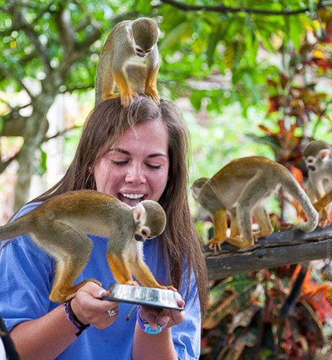 Women holding monkeys in Punta Cana