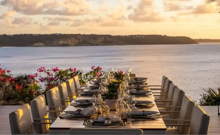 Oceanfront dining table at sunset in Las Terrenas