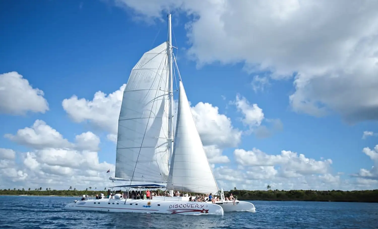 Guests aboard the large catamaran sailboat during the trip to Saona Island.